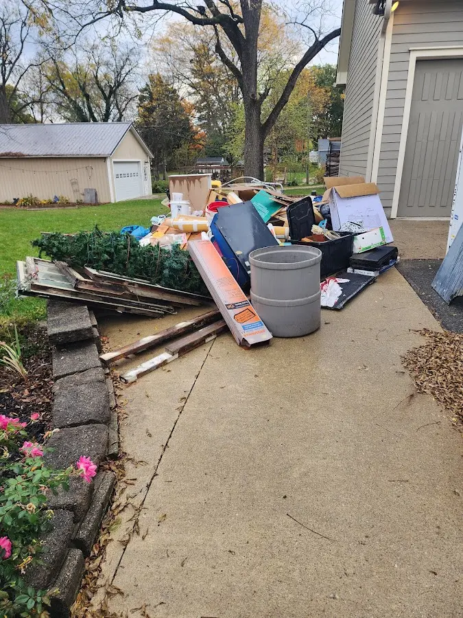 Dumpster being loaded with debris for Estate Cleanout Dumpster Rental in Bethlehem